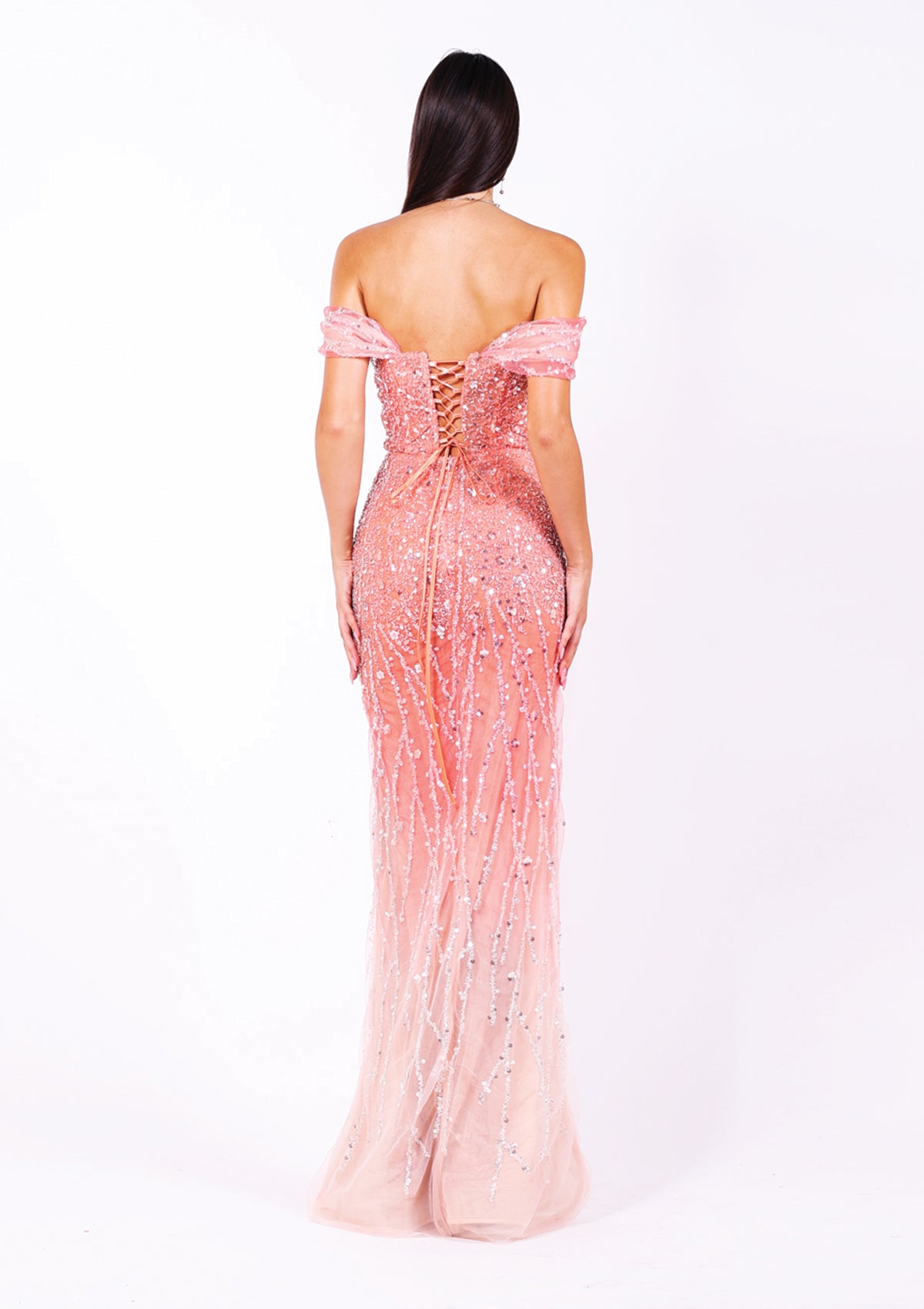 Дълга абитуриентска рокля Dolomite LIZA KAIN София. Официална розова рокля с ефект омбре от корал до бледорозово, покрита с блестяща бяла дантела от камъчета и пайети. Корсет с вързки и подвижни паднали презрамки. Пола с преливащ ефект и шлиц.