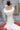 Елегантно бяло болеро LIZA KAIN Bridal с декорация от сатенени рози и добавен фин тюлен шлейф.