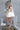 Елегантна къса булчинска рокля Daisy Belle Epoque LIZA KAIN Bridal с корсетна конструкция, сърцевидно деколте, деликатни перлени акценти и обемна бяла сатенена пола. Закопчаване с връзки на гърба.
