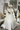 Официална булчинска рокля Veneris LIZA KAIN Bridal с дълга обемна тюлена пола, брокатени слоеве и корсетирана горна част с ръчно нашита дантела.