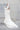 Долната част на сватбената рокля Caelina от LIZA KAIN bridal, показваща прехода от прилепналия силует към обемна пола от няколко пласта мек тюл. Дизайнът завършва с ефирен шлейф, който придава въздушност при всяка крачка.