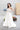 Стилна сватбена рокля от LIZA KAIN bridal с втален корсет. Деликатна драперия подчертава талията, а нежна дантела украсява горната част. Акцент са дългите бродирани ръкавици, които завършват визията.