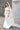 Булчинска рокля Hermione Lumière от LIZA KAIN bridal в изчистен и изискан силует „русалка“. Горната част се отличава с паднали рамене и издължен корсет, който прелива в гладка пола с фин шлейф. Моделът подчертава фигурата с изключителна прецизност и изтънченост.