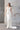 Тренди булчински силует от две части Margarita Lumière от LIZA KAIN bridal, съчетаващ скулптурен корсет и елегантна пола тип „русалка“. Моделът завършва с фин шлейф, който придава изтънченост и визуално издължава фигурата.