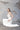 Горната част на модела Margarita Lumière от LIZA KAIN bridal с уникално деколте между сърцевидна форма и стил „лодка“. Тази линия деликатно оформя бюста и насочва вниманието към раменете.