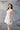 Близък кадър на корсета на сватбената рокля Arwen Celestia от LIZA KAIN bridal. Дизайнът прецизно оформя талията и създава изразителен акцент в бюста, подчертавайки женствената линия.