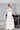 Долната част на булчинската рокля от LIZA KAIN bridal, показваща изчистена пола тип русалка с дълбока цепка. Дизайнът добавя чувствена лекота и осигурява красиво, естествено движение при всяка стъпка.