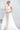 Булчинска рокля Rubelle Grande от LIZA KAIN bridal, предлагаща зашеметяваща трансформация на силуета за сватбения ден. Моделът балансира между блясъка на прилепналата дантелена рокля и грандиозността на кралския тюлен шлейф.