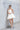 Къса елегантна официална рокля Elegant Mini от LIZA KAIN bridal, посипана с магичен звезден прашец. Моделът се отличава с блестяща текстура и изчистен силует, перфектен за втора булчинска визия.