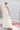 Булчинска рокля Melanie Doucer от LIZA KAIN bridal с издължен силует, вдъхновен от класическата елегантност. Горната част се състои от структуриран корсет, който плавно преминава в плисирана пола от фин лек сатен. Моделът съчетава ретро детайли със съвременна модна линия.